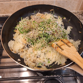 Stir in the sprouts and cook for 1–2 minutes, just until wilted and fragrant. Season with black pepper and optional spices.