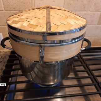 Bring water to a boil in a wok or wide pot. Place the bamboo steamer on top (with lid), making sure the water doesn’t touch the buns. Steam buns for 12–13 minutes. Turn off heat, let them sit covered for 3 minutes before opening the lid. Serve warm for the best gooey center.