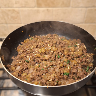 All filling ingredients mixed on a skillet