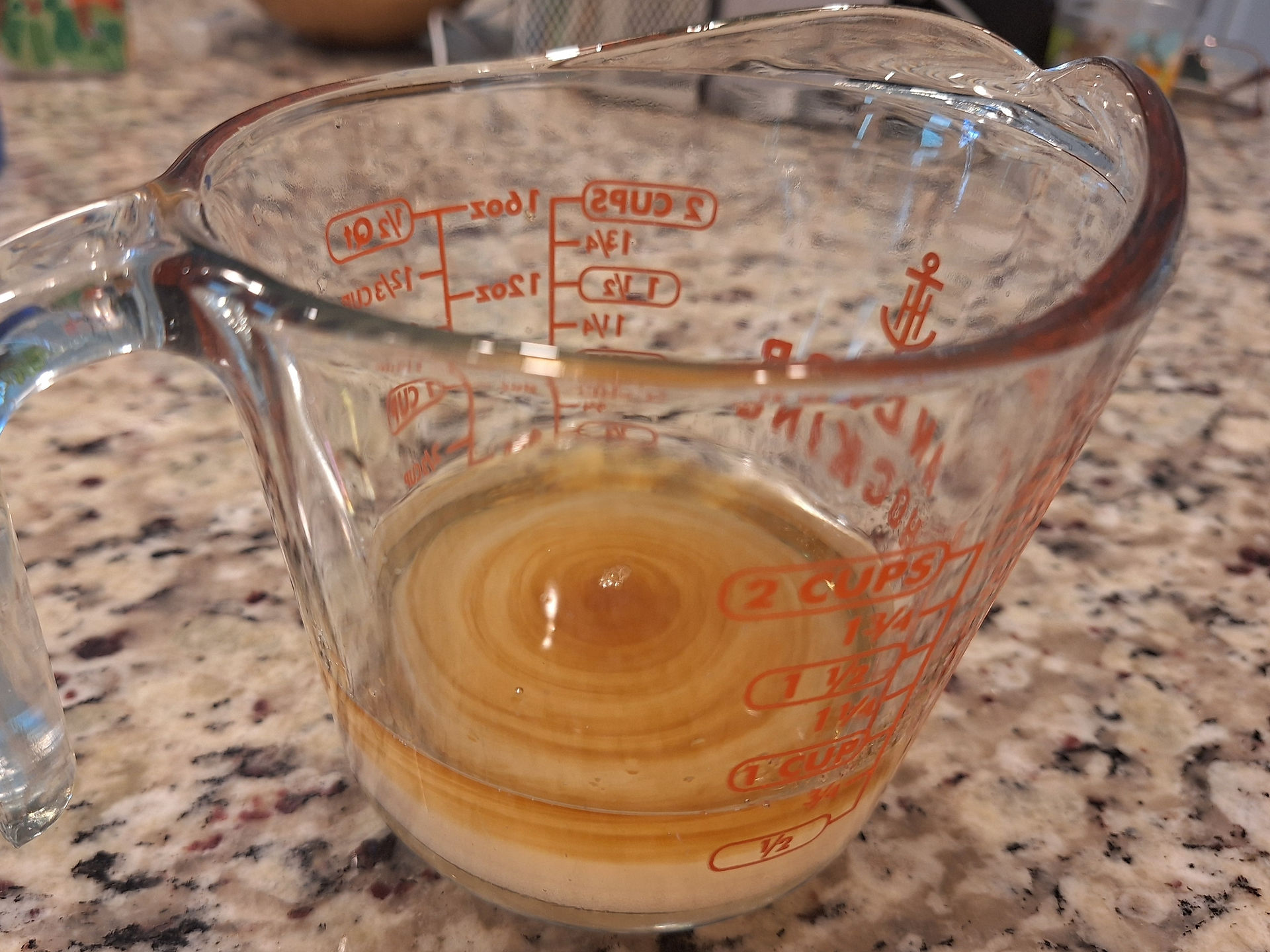 syrup ingredients in a measuring cup unmixed