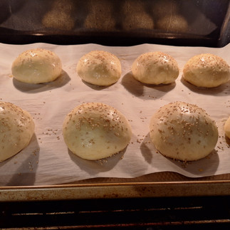 Preheat your oven to 375°F (190°C). Optionally, brush the tops with milk or egg wash and sprinkle sesame seeds. Bake for 10 minutes, or until golden brown.