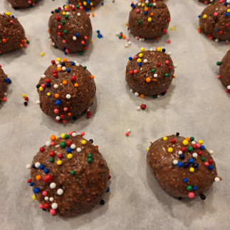 Roll the mixture into 1-tablespoon-sized balls. If desired, roll each ball in oat flour or top with natural sprinkles for added appeal.