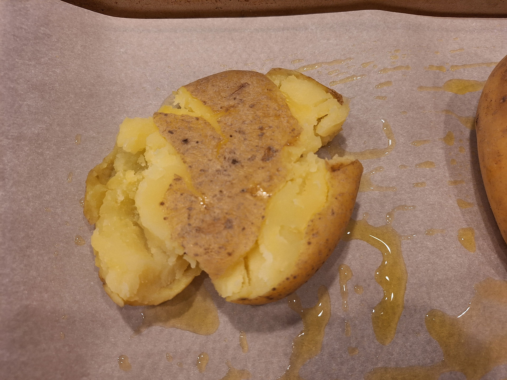 Preheat oven to 425°F (220°C). Lightly grease a baking sheet. Place steamed potatoes on the sheet and smash them to about ½-inch thick with the back of a spoon or potato masher.