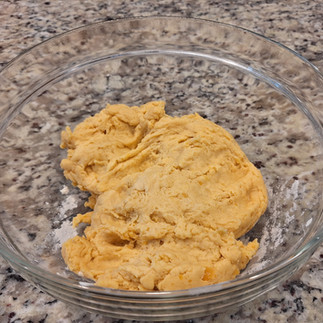 Dough in glass bowl