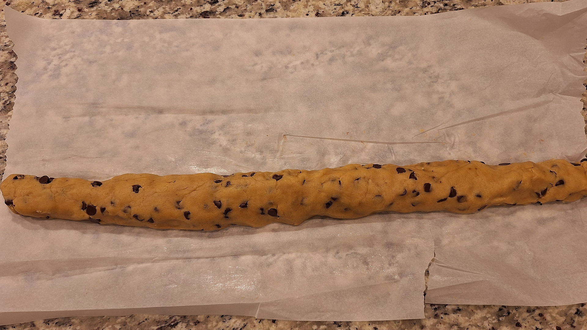 shape the dough into a log about 2 inches in diameter, wrap it tightly in parchment or plastic wrap, and chill using one of the following methods: Quick Method: Freeze for 1.5 hours for a faster option. Best Flavor & Texture: Refrigerate overnight for 8–12 hours to fully develop flavors.