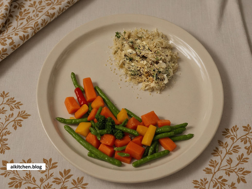 Plate with mixed vegetables and scrambled egg dish on beige tablecloth. Visible text: aikitchen.blog. Warm, cozy setting with floral design.