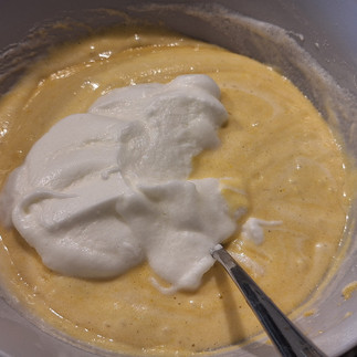Gently fold egg whites into batter.