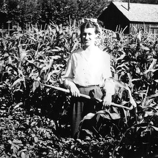 farm woman in field of corn