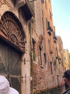 Walls rising above Venetian canals