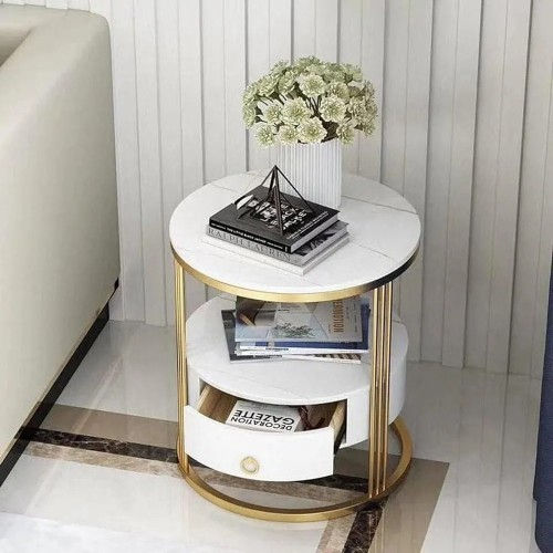 Front view of round white marble end table with gold frame and open storage drawers