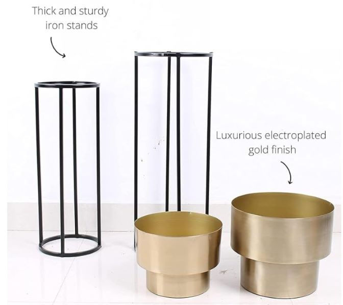 Set of two modern black iron plant stands paired with luxurious electroplated gold metal planters