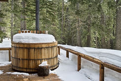 Nice wooden hot tub covered with snow.jpeg