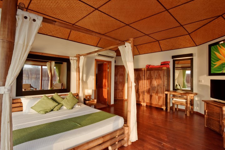 Safari island resort Maldives Over water villa master bedroom