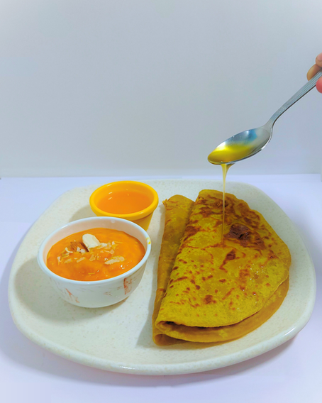soft puran poli served with desi ghee and aamras