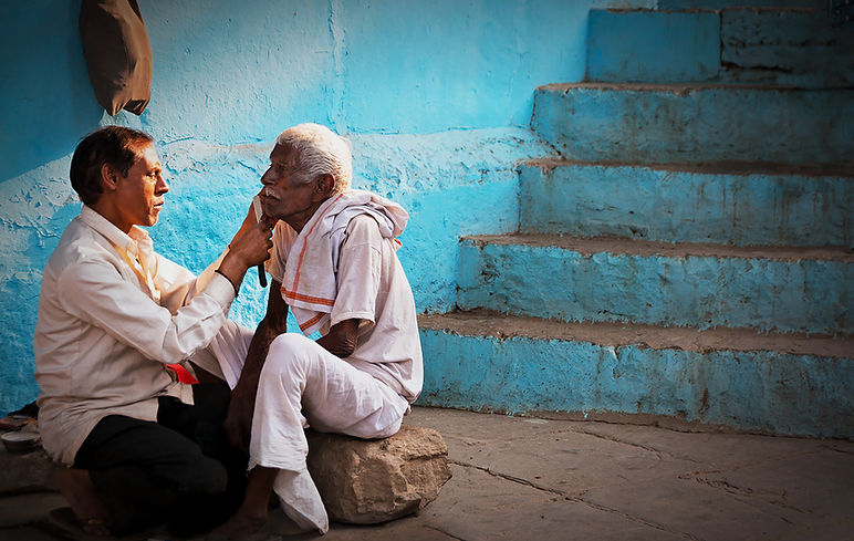 18 CARE FOR A SHAVE - a typical street scene.jpg
