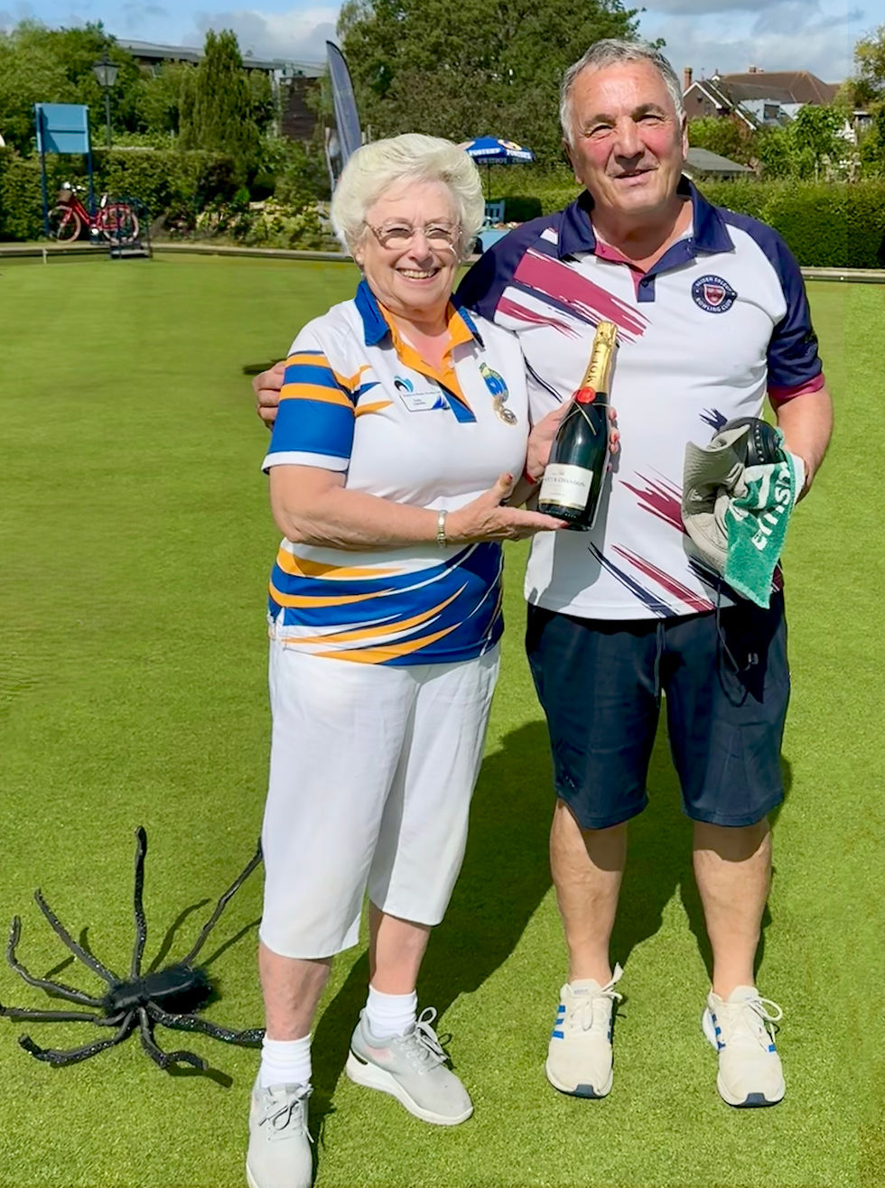 Chair Sally presenting the "Spider" prize to Ross.