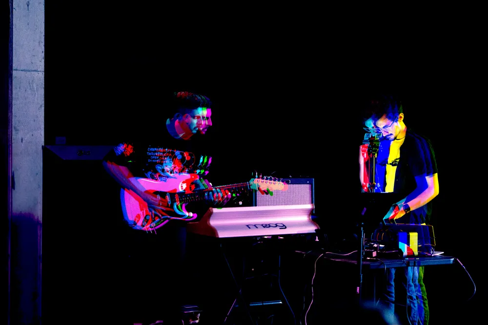 Core Memory, a multimedia project by McKinley and Harrison Foster, draws inspiration from electronic artists like Four Tet and Caribou. McKinley, based in NYC, focuses on crafting instrumental music that blends lo-fi, synths, and intricate guitar work, while Harrison, based in LA, brings his expertise in lighting design to enhance their live performances with adaptive visuals.