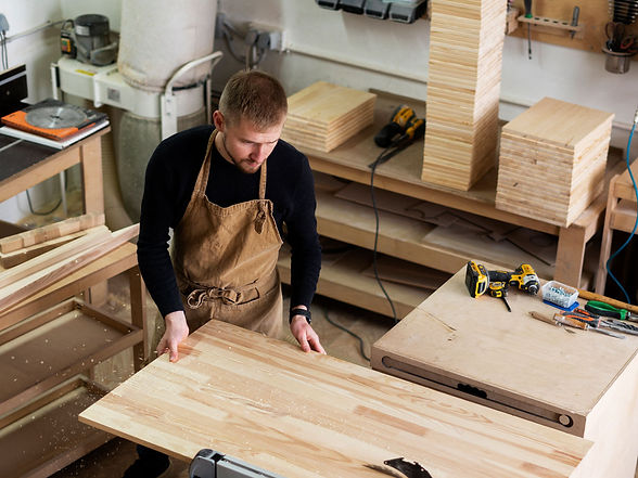 carpenter-works-with-tree-(1).jpg
