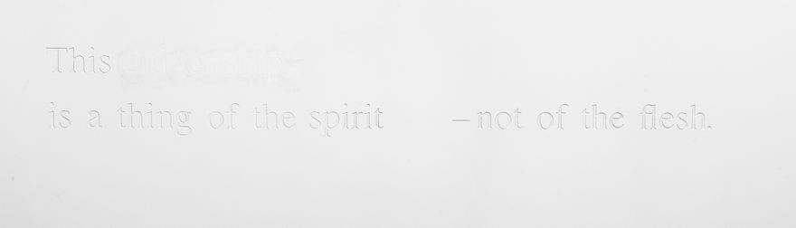 white wall with white words