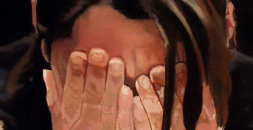 woman with face in hands