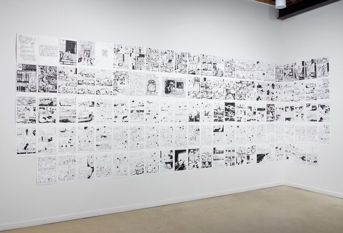 many small paper works with black and white ink drawings exhibited in grid formation