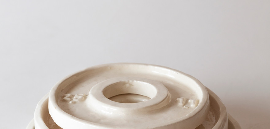 three ceramic circular forms 