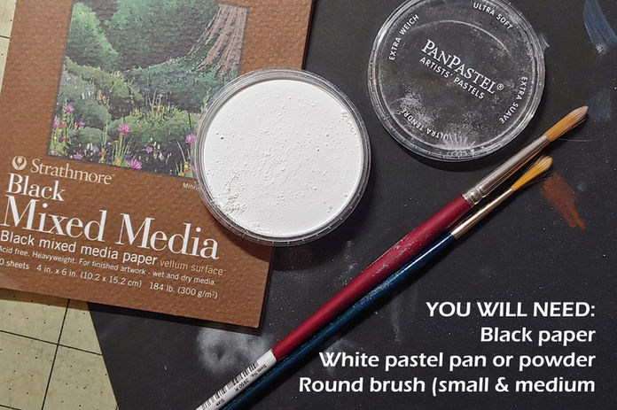 paper with pan of white powder and two brushes