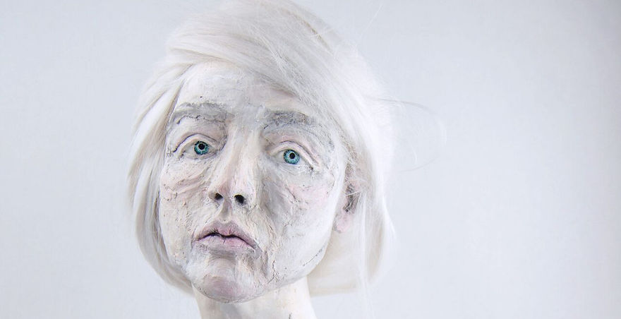 bust of woman with white skin in paper mache 