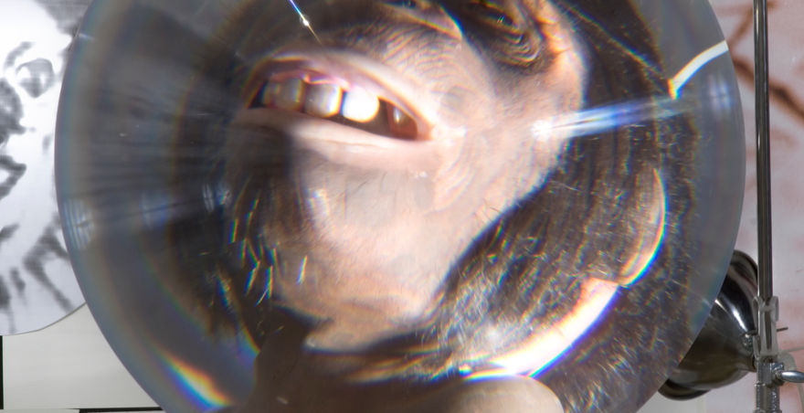 monkey suspended in glass orb 