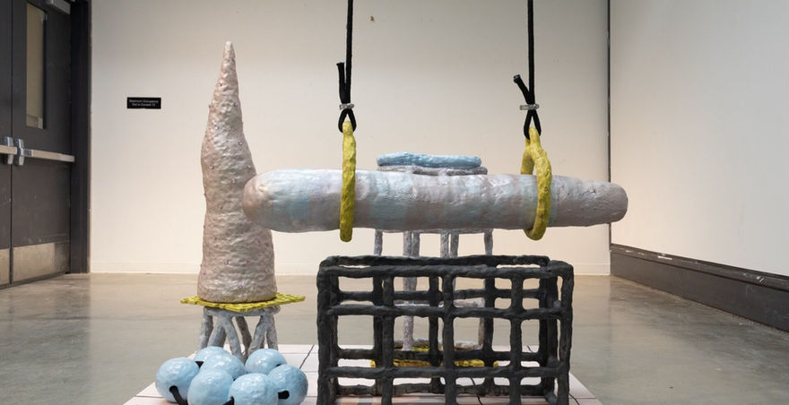 sculpture with abstract forms made from paper mache with dull painted colors 