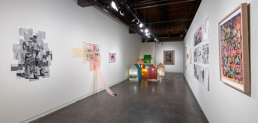 gallery with abstract work displayed on walls and sculptural pieces on the floor