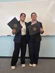 girls flaunting certificate
