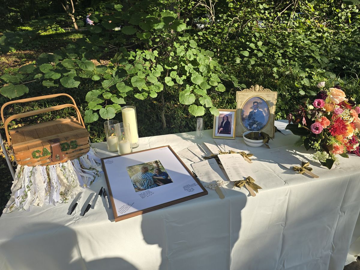 Guests could sign a photo frame, and the wedding party and ceremony info were printed on both sides of a cute fan (or sun shade as they functioned on this day).