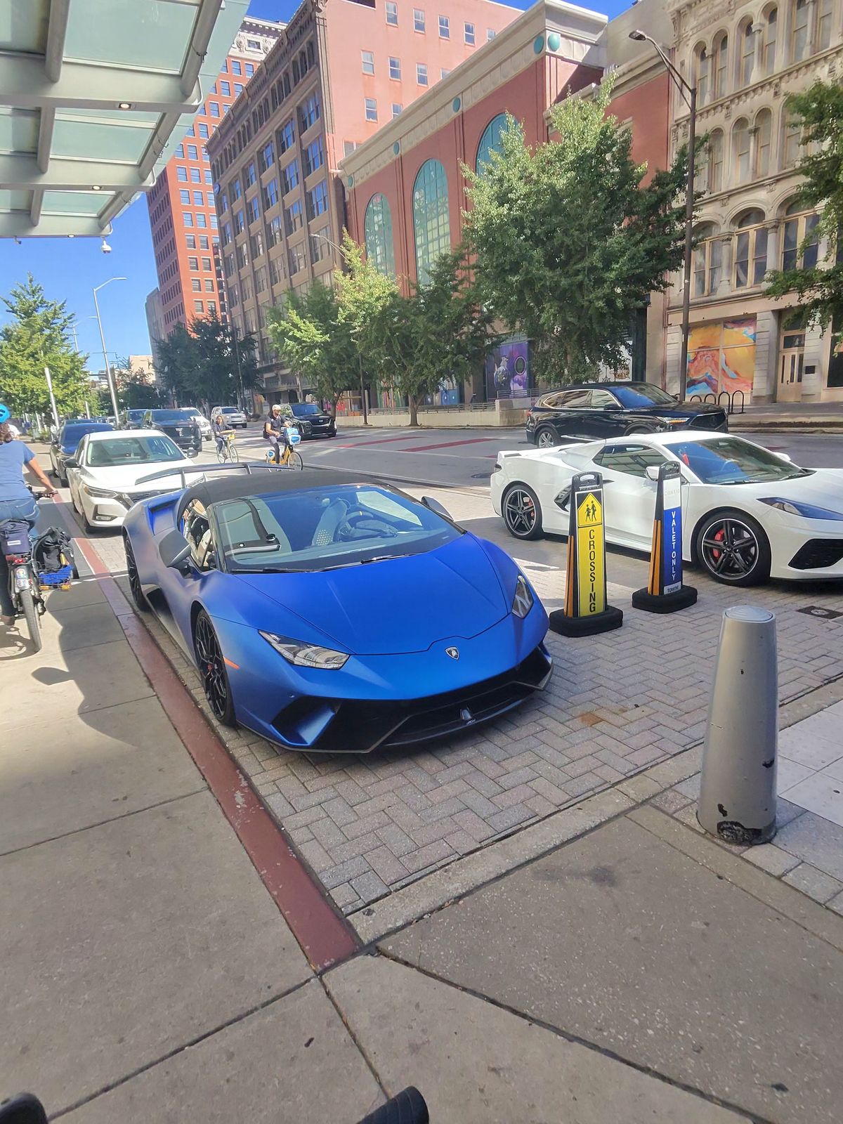 This is a very odd spot in the trail.  The official bike trail gets taken over by valet parking for mega cars.  Hope we don't scratch one.