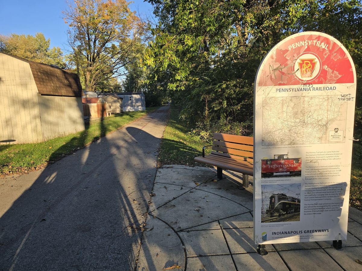 We stopped beside a trail history marker and a bench.