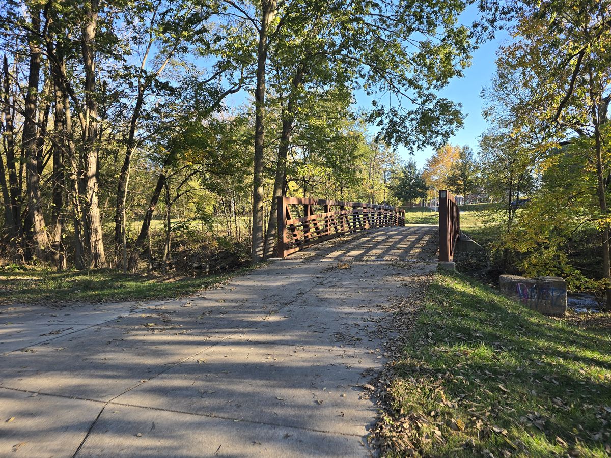 A tree-lined bridge along the Pleasant Run Trail.