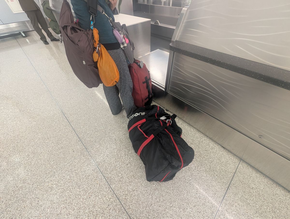 Checking in at the airport in Indy - one checked backpack a piece, plus a carry-on item each.