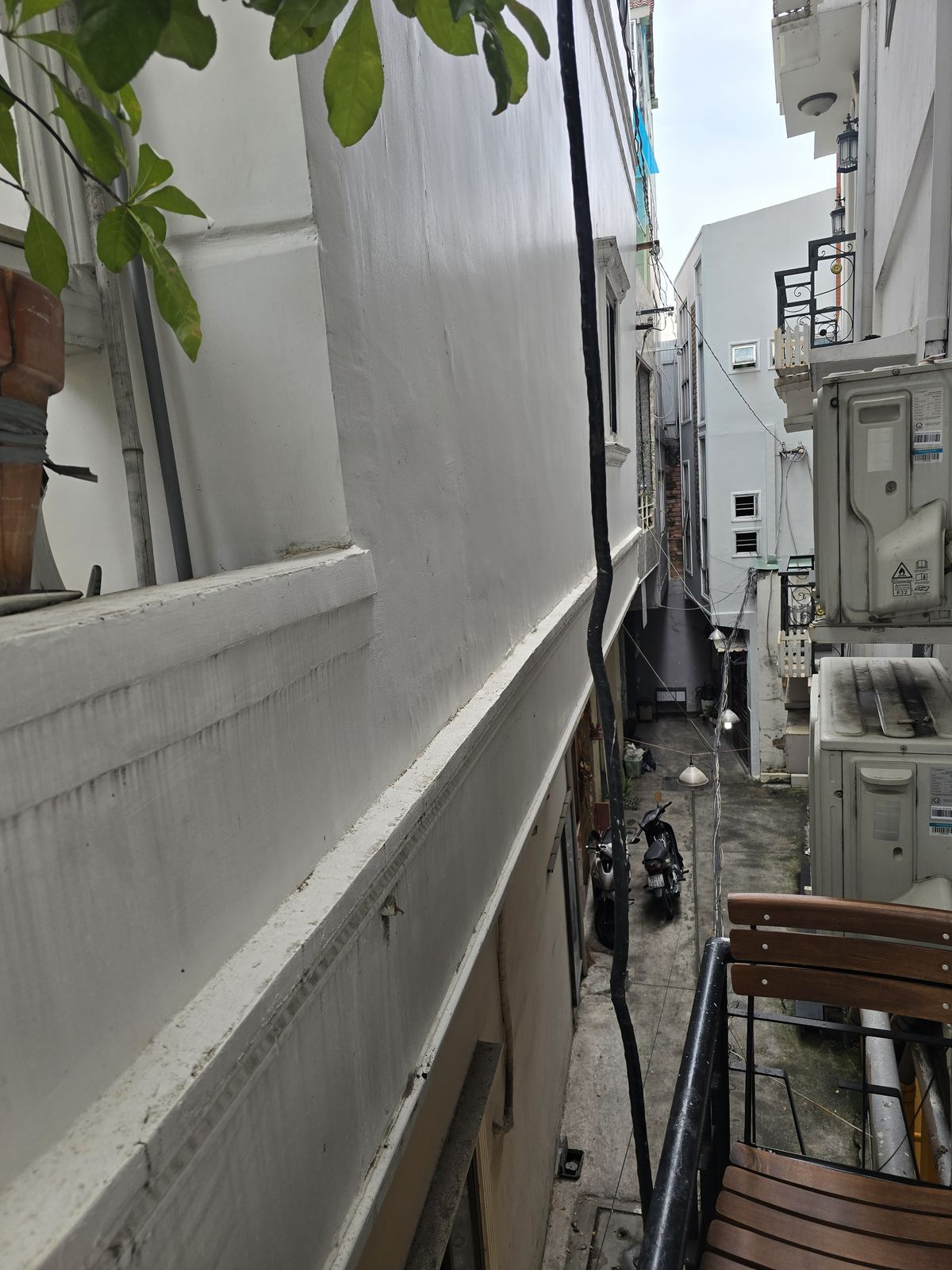 The view in the other direction from our balcony. We can reach out and touch the building next door without even fully extending our arms.