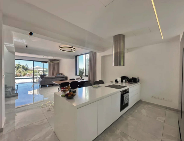Stylish home interior with clean bedroom and kitchen