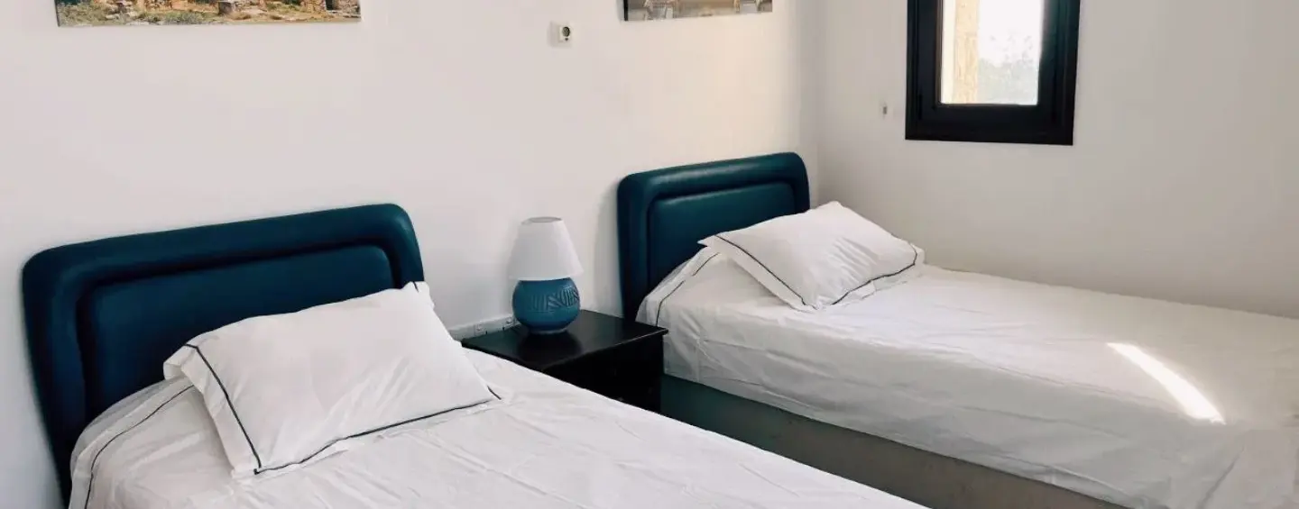 Twin bedroom with natural light