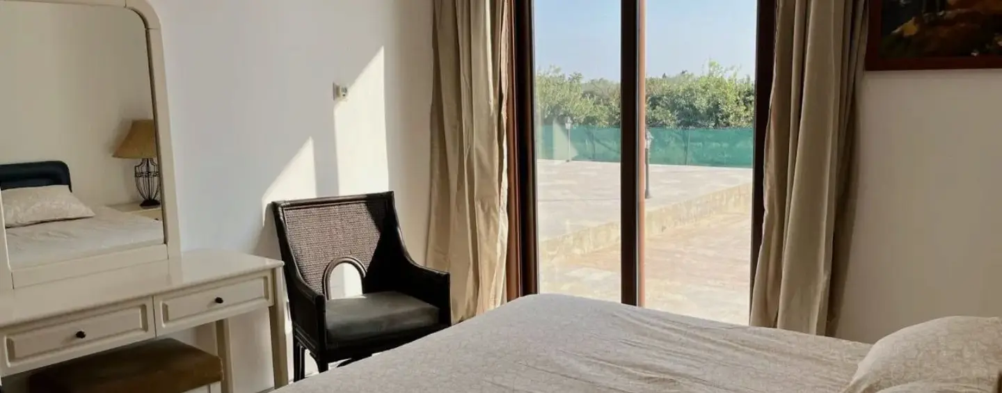 Bright bedroom with balcony access