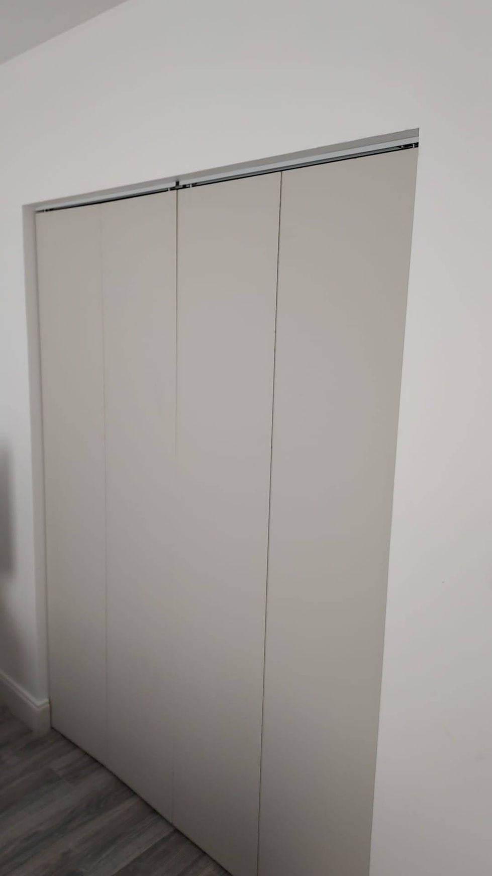 a white door with a white wall behind it