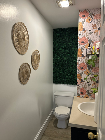 A washroom with floral wall paper