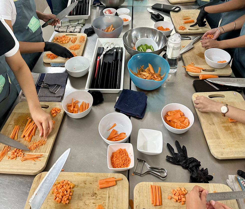 Students at The Vegan School learning different cuts