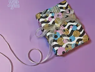 neatly wrapped gift box with clean folds and ribbon bow