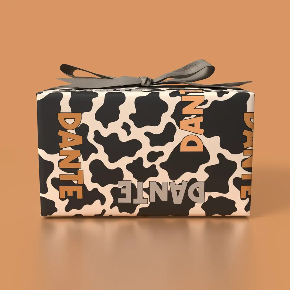 custom birthday wrapping paper with cow print and orange letters