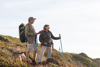happy-elderly-family-hiking-summer-man-woman-casual-clothes-with-ammunition-looking-landsc