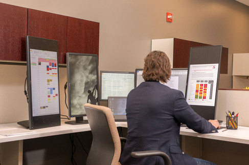 Office photo creative executive working on vertical monitors