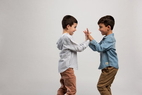 playful chicago brothers portrait in studio