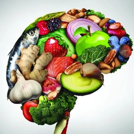 Illustration of a brain filled with vegetables, fruits, and fish, highlighting the connection between nutrition and brain health.